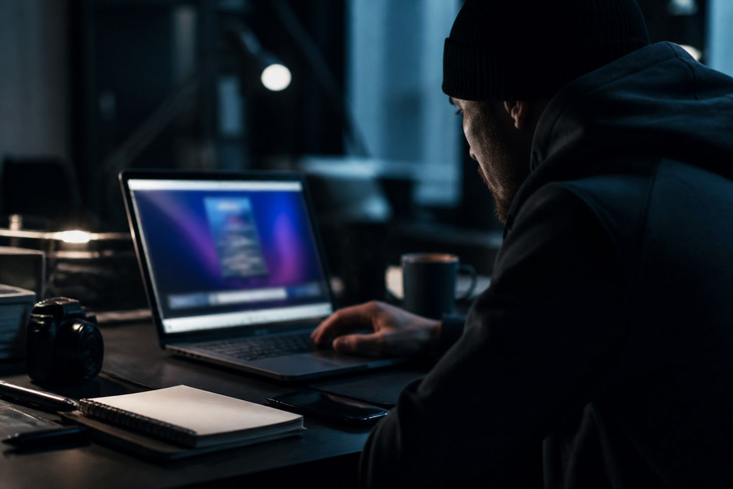 A user engaged in research on dark web sites in a modern office setting.